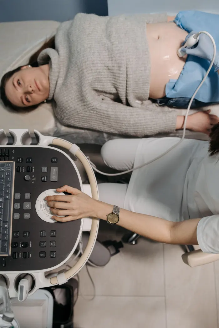 Patient smiling during a scan at the clinic