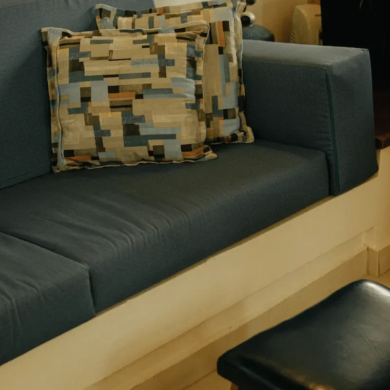 Blue sofa with abstract patterned cushions